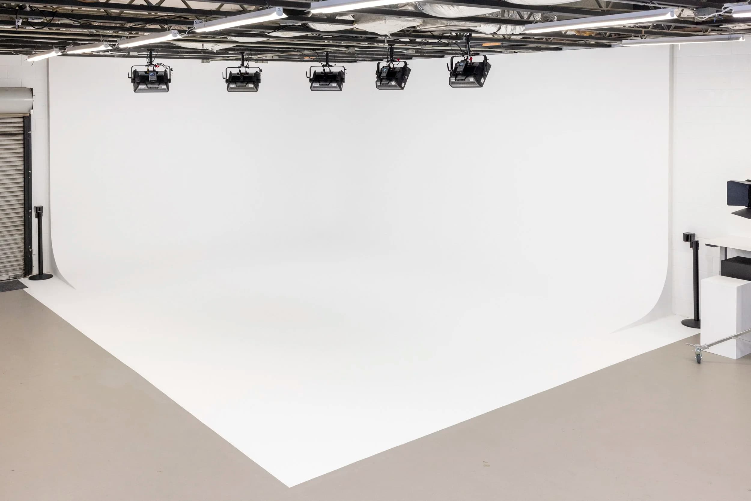 The corner cyc wall at Summit Studios with five Aputure Nova fixtures rigged above it