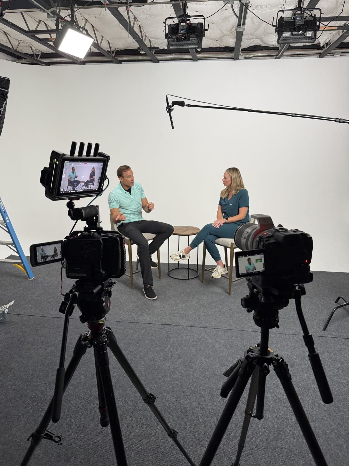 A two-person podcast-style conversation filmed with two cameras at Summit Studios