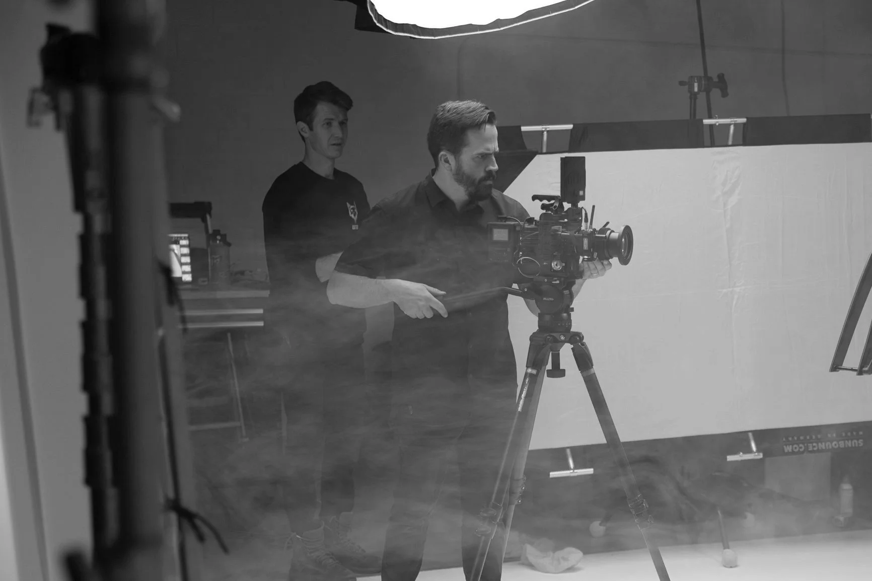 A camera operator lines up a shot during a video production at Summit Studios